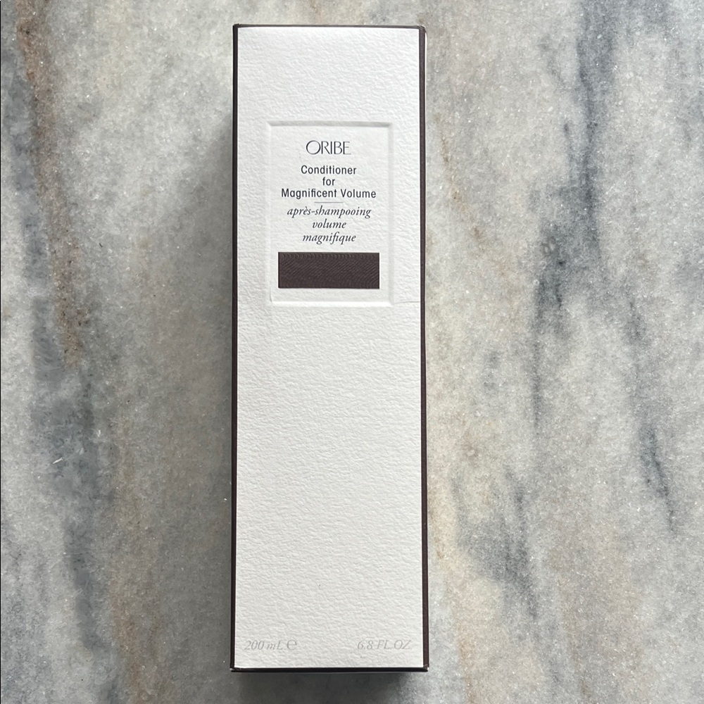 Oribe Magnificent Volume Conditioner in White and Dark Brown Box